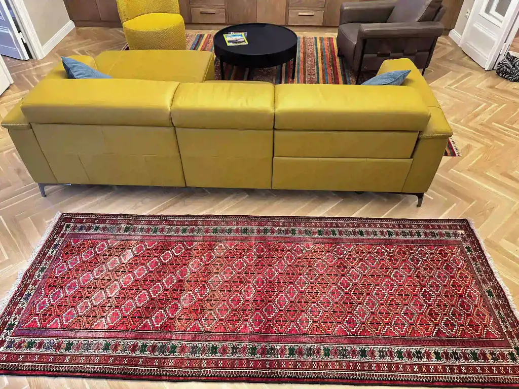 Quiet bedroom vignette featuring a vintage kilim