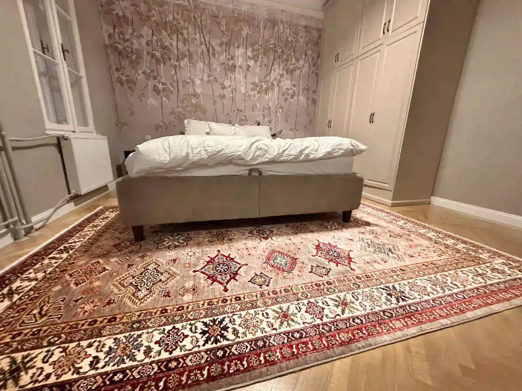 Curated salon with moody lighting and hand-knotted textures