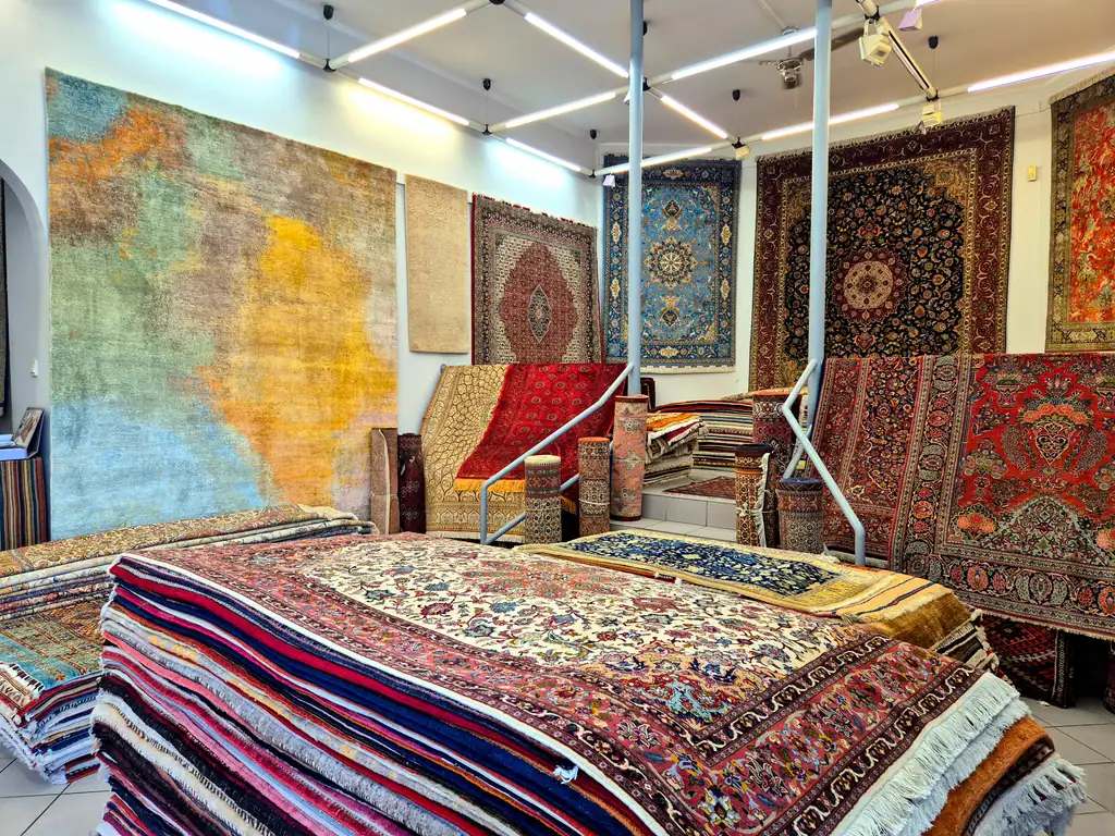 Interior of the Bizsan Rug Gallery with hand-knotted carpets on display